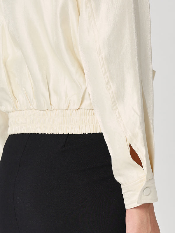 Giacca lucida con zip e balze