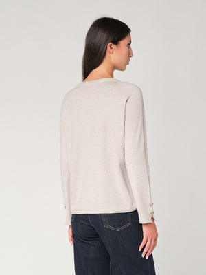 Maglia con bottoni polso