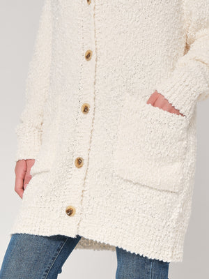 Maglione con bottoni e tasche
