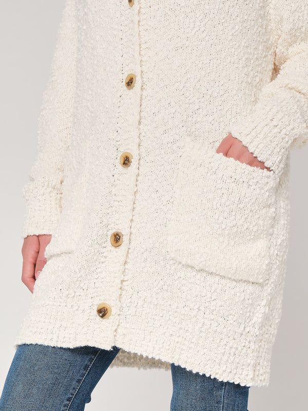Maglione con bottoni e tasche