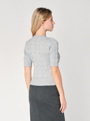 Maglia a trecce con perline