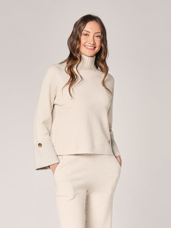 Completo con lurex sul polso