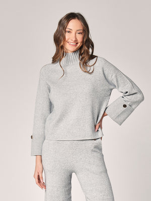 Komplett mit Lurex am Handgelenk