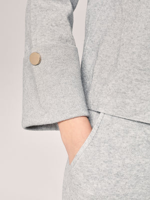 Komplett mit Lurex am Handgelenk