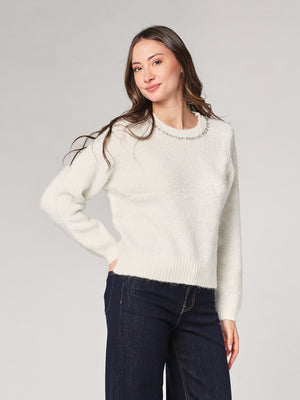 Maglia con paillettes e applicazioni