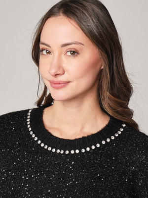 Maglia con paillettes e applicazioni