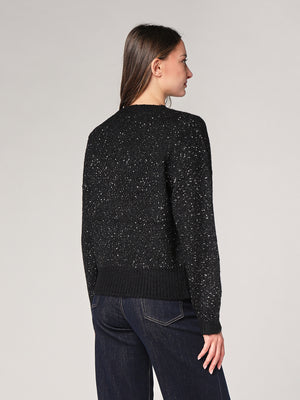 Maglia con paillettes e applicazioni