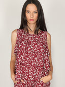 Top fantasia floreale con balze