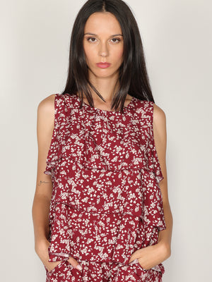 Top fantasia floreale con balze