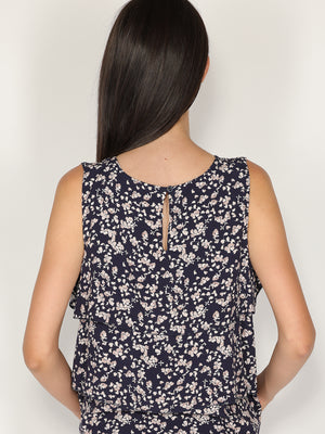 Top fantasia floreale con balze
