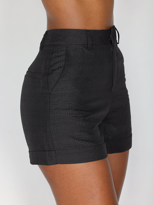 Shorts con motivo a D