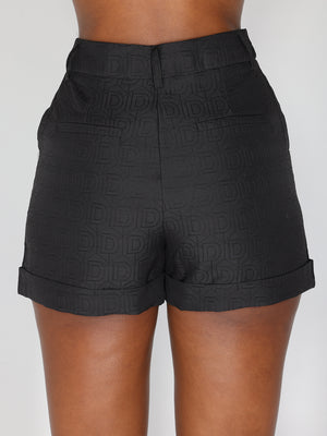 Shorts con motivo a D