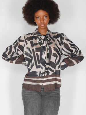 Camicia in fantasia con fiocco