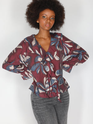 Maglia in fantasia con collo balze