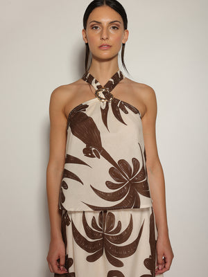 Top in fantasia floreale con gioello