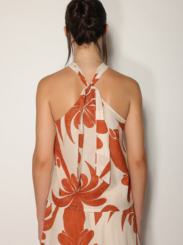 Top in fantasia floreale con gioello