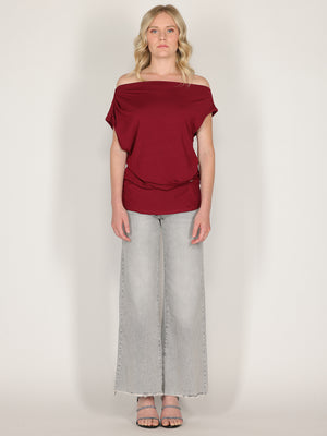 Maglia con bottone laterale