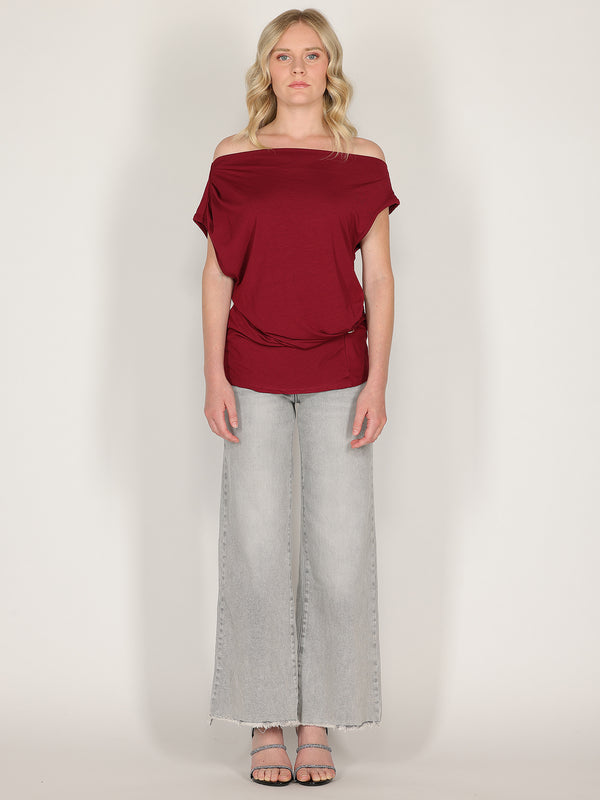 Maglia con bottone laterale