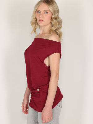Maglia con bottone laterale